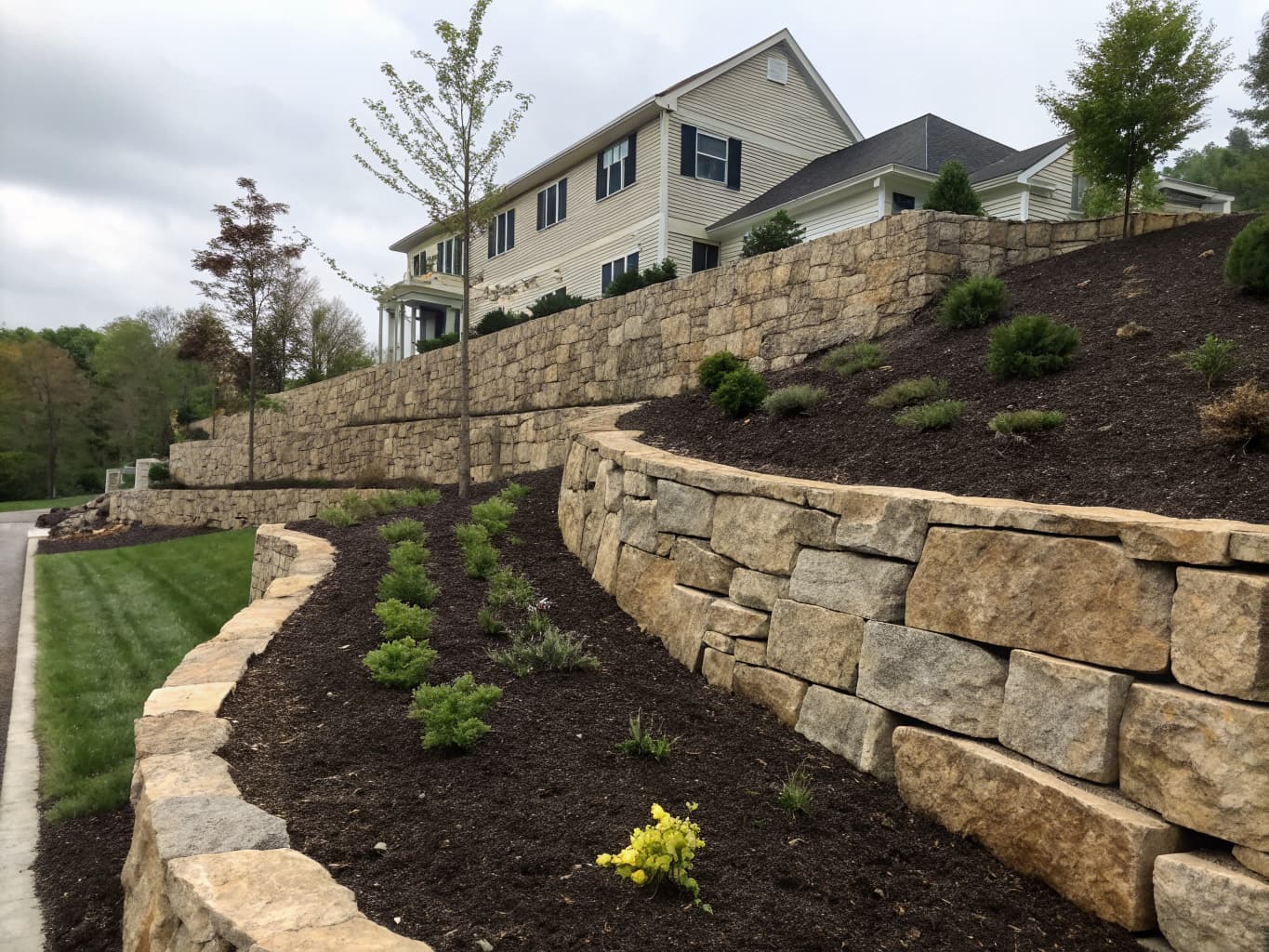 Professional natural stone retaining wall by Holmes Outdoor